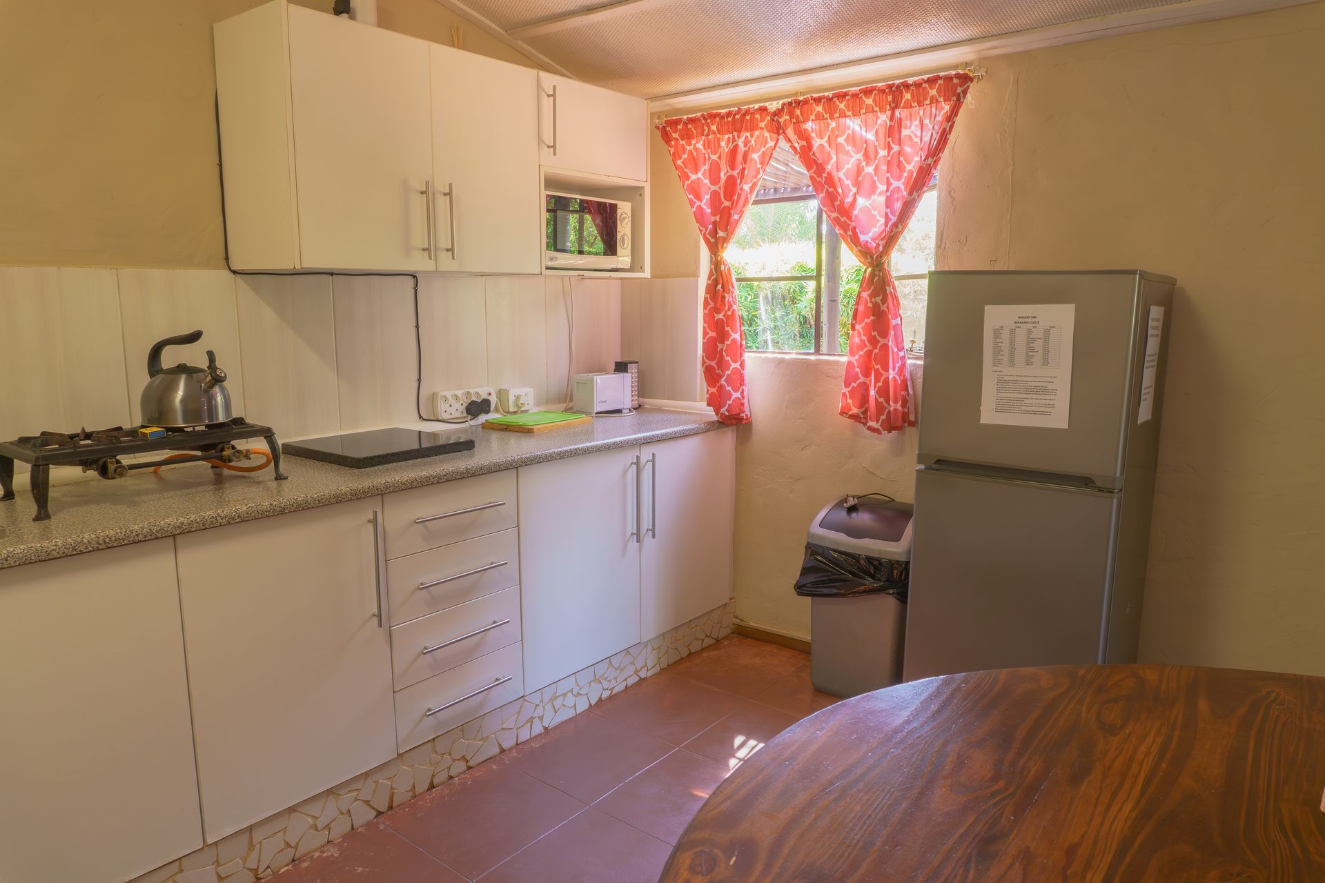Private patio of 2-sleeper chalet at Gallery Inn Bela Bela