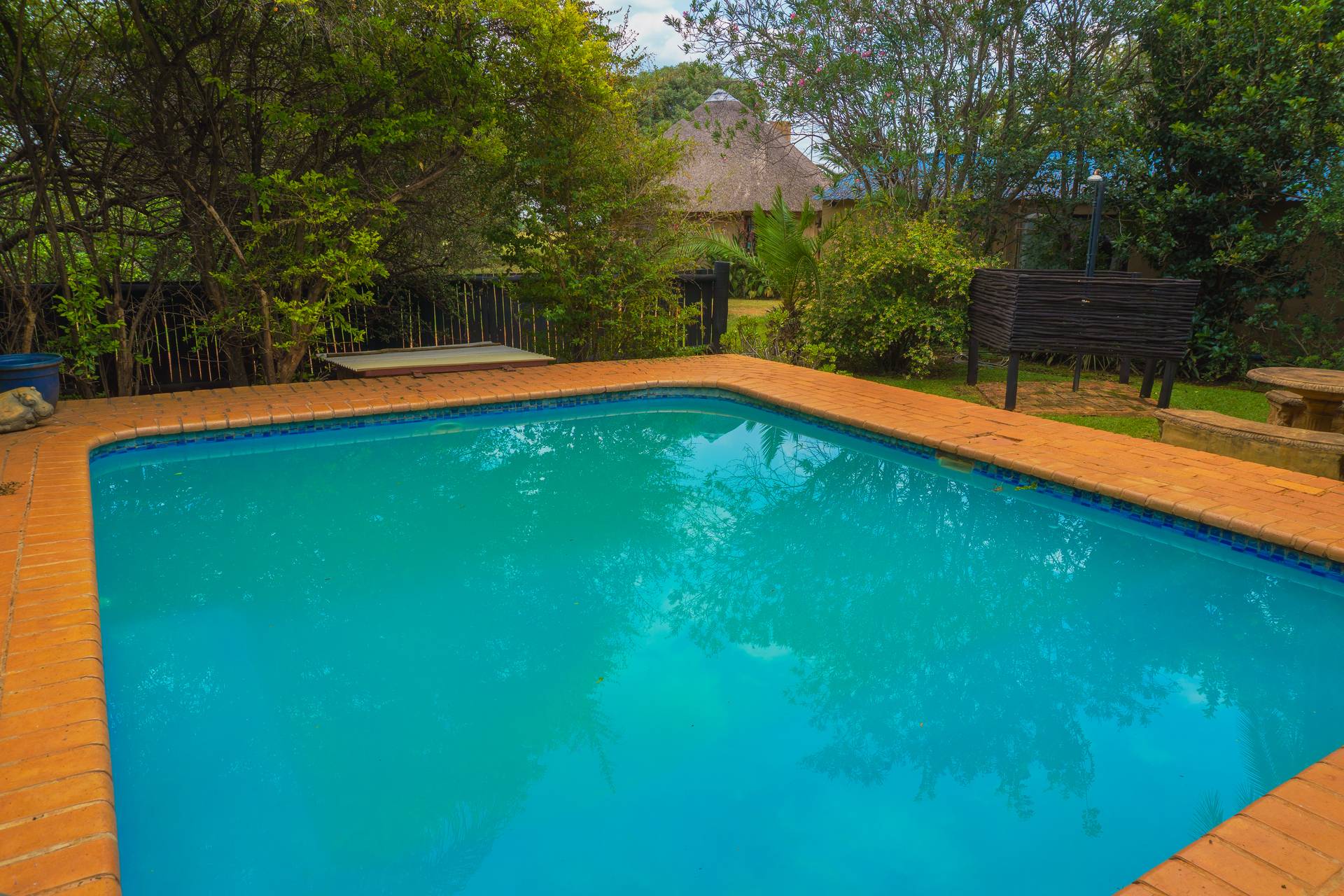Main swimming pool with sun loungers at Gallery Inn Bela Bela